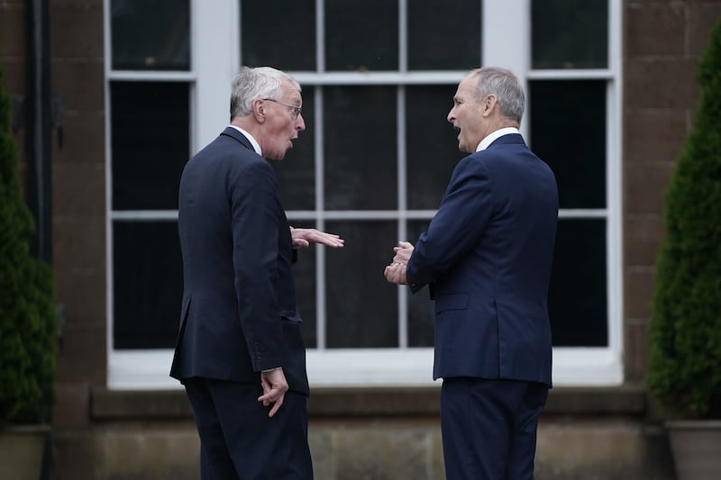 Northern Ireland Secretary Hilary Benn (left) and Tanaiste Micheal Martin ahead of a meeting at Hillsborough Castle in Belfast