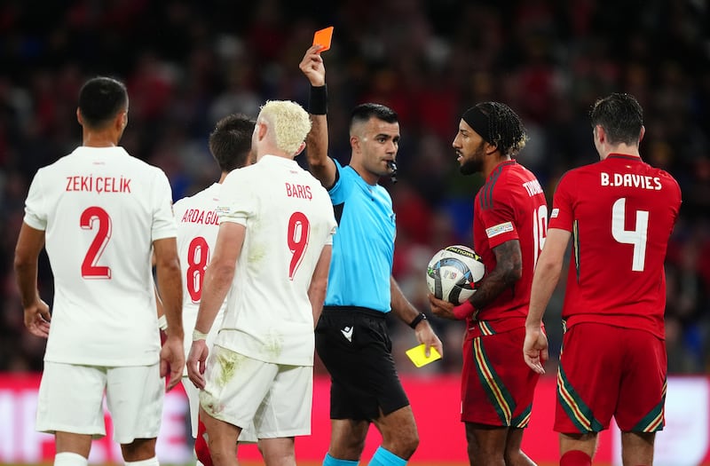 Turkey’s Baris Alper Yilmaz, centre left, is sent off against Wales