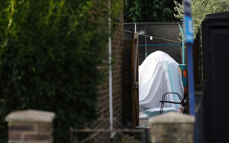 A view into the back garden of the property in Bremer Road, Staines-Upon-Thames where three children and a man were found dead