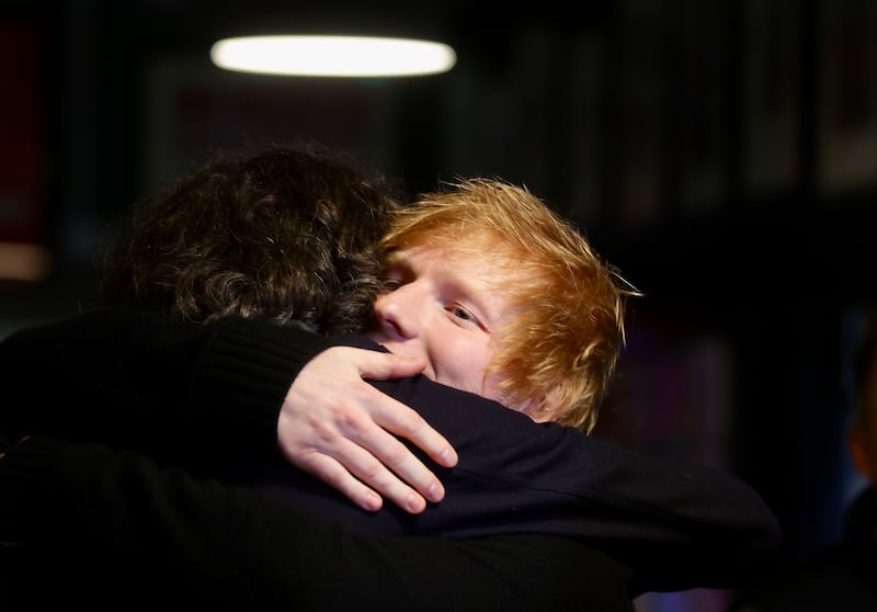 Ed Sheeran and Gary Lightbody  with Charlotte Dryden  who speak to the media at the Oh Yea Centre during a visit to Belfast.
PICTURE COLM LENAGHAN