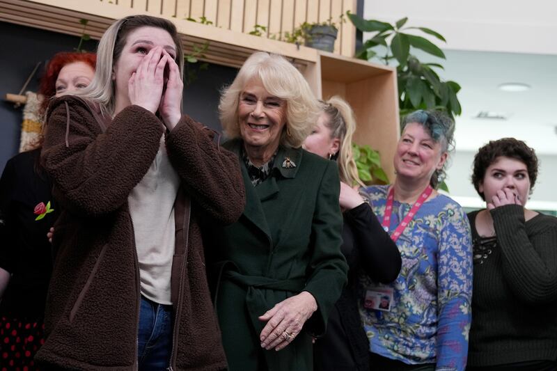 Queen Camilla comforts service user Sarah during a visit to CoLab Exeter