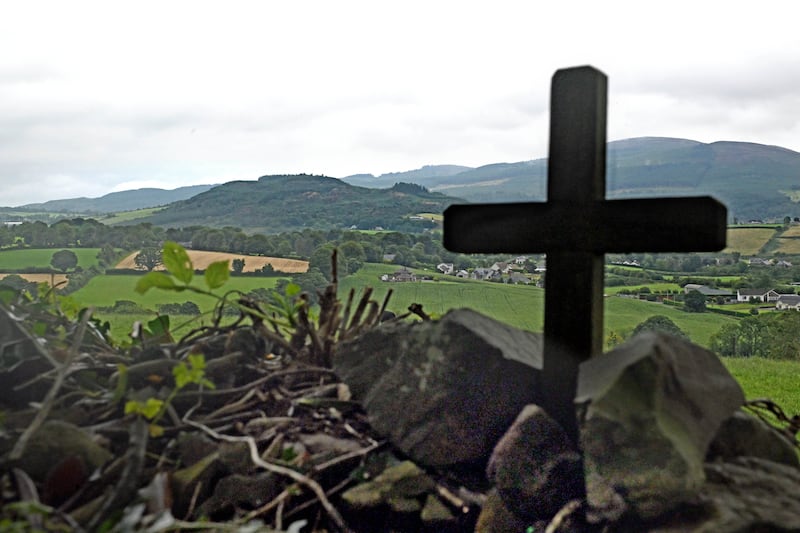 Alan Lewis - PhotopressBelfast.co.uk       26-8-2024
The Hill of Faughart, (left of centre), pictured from the graveyard where the remains of Edward the Bruce lie. 
Today, (Monday),  Jon Hill, head of the International Commission for the Location of Victims’ Remains, speaking at a press Conference near the County Louth border with Northern Ireland revealed details of the new search for the remains of SAS Captain Robert Nairac who was abducted, murdered and secretly buried by the Provisional IRA in 1977. 
Captain Nairac is one of the so-called ‘Disappeared’.
The search for his remains is centred on a small area on private farmland near an ancient Irish battle site on the Hill of Fauqhart.