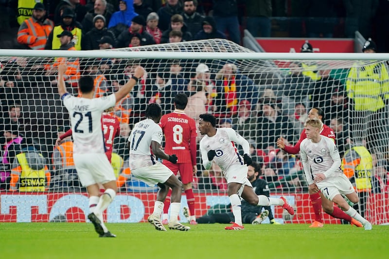 Jonathan David, centre right, wheels away to celebrate his equaliser