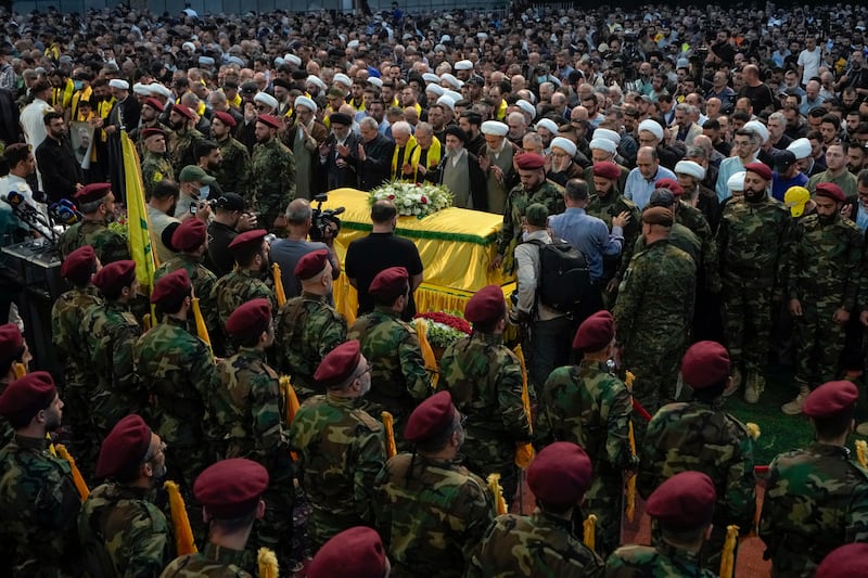 Mourners pray over the coffin of senior commander Mohammad Naameh Nasser, who was of great importance to Hezbollah. The group said he took part in battles in conflicts in Syria and Iraq from 2011 until 2016 and fought in the group’s last war with Israel in 2006.(Bilal Hussein/AP)