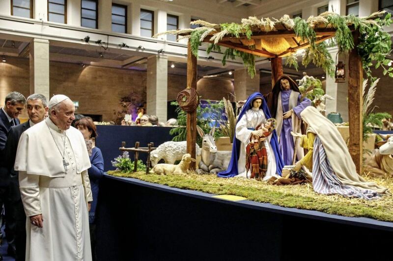 Pope Francis has put treatment of refugees at the centre of his papacy. Pictured during a visit to a &#39;100 nativity scenes at the Vatican&quot; exhibition last Christmas, the Pope looks at a depiction of the Holy Family, who also knew what it was to flee from danger. Picture by Fabio Frustaci/Pool Photo via AP 