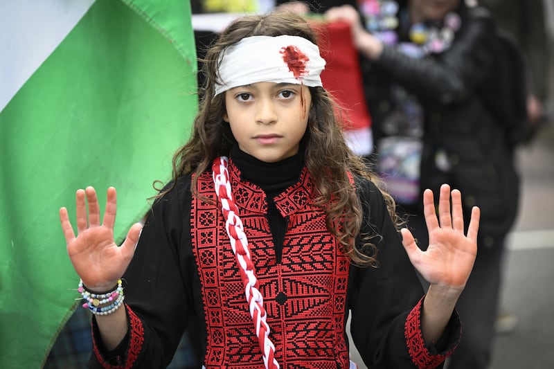 People took part in a silent funeral procession through Edinburgh city centre as part of the Scottish National Demonstration for Palestine on Saturday