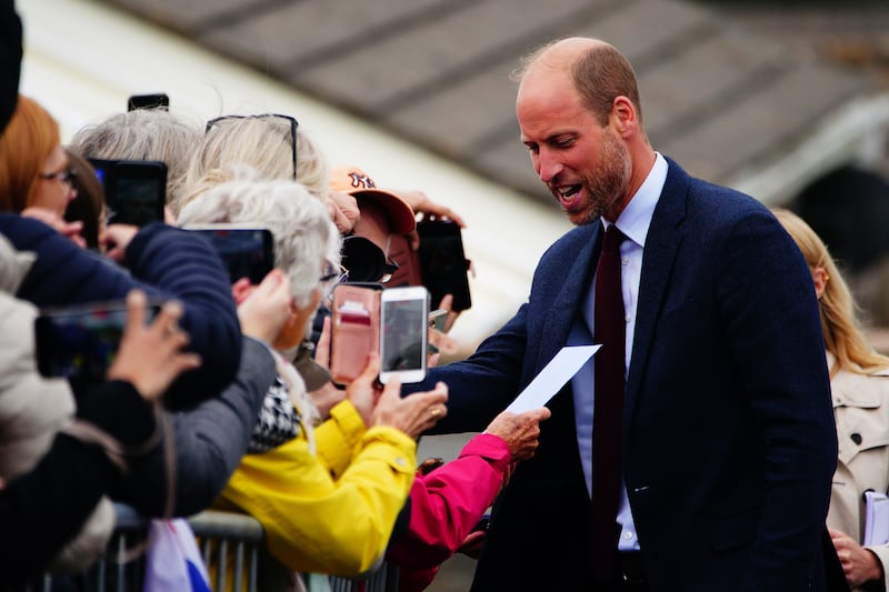 William chatting to well-wishers outside the school