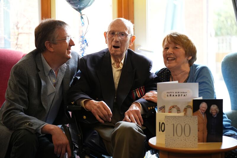 Ian Brignall and Sue Whelan sit with their father Ronald Brignall before the presentation