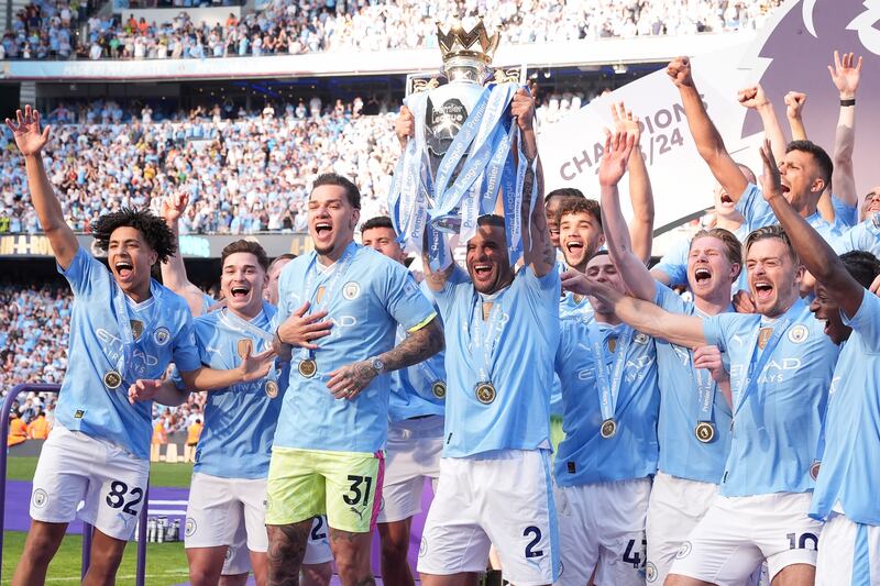 Manchester City skipper Kyle Walker lifts the Premier League trophy