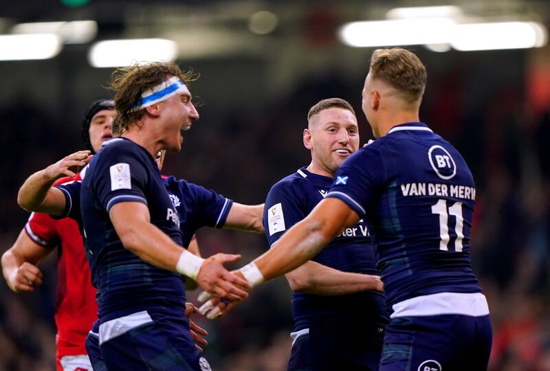 Scotland players celebrate a try against Wales in Cardiff
