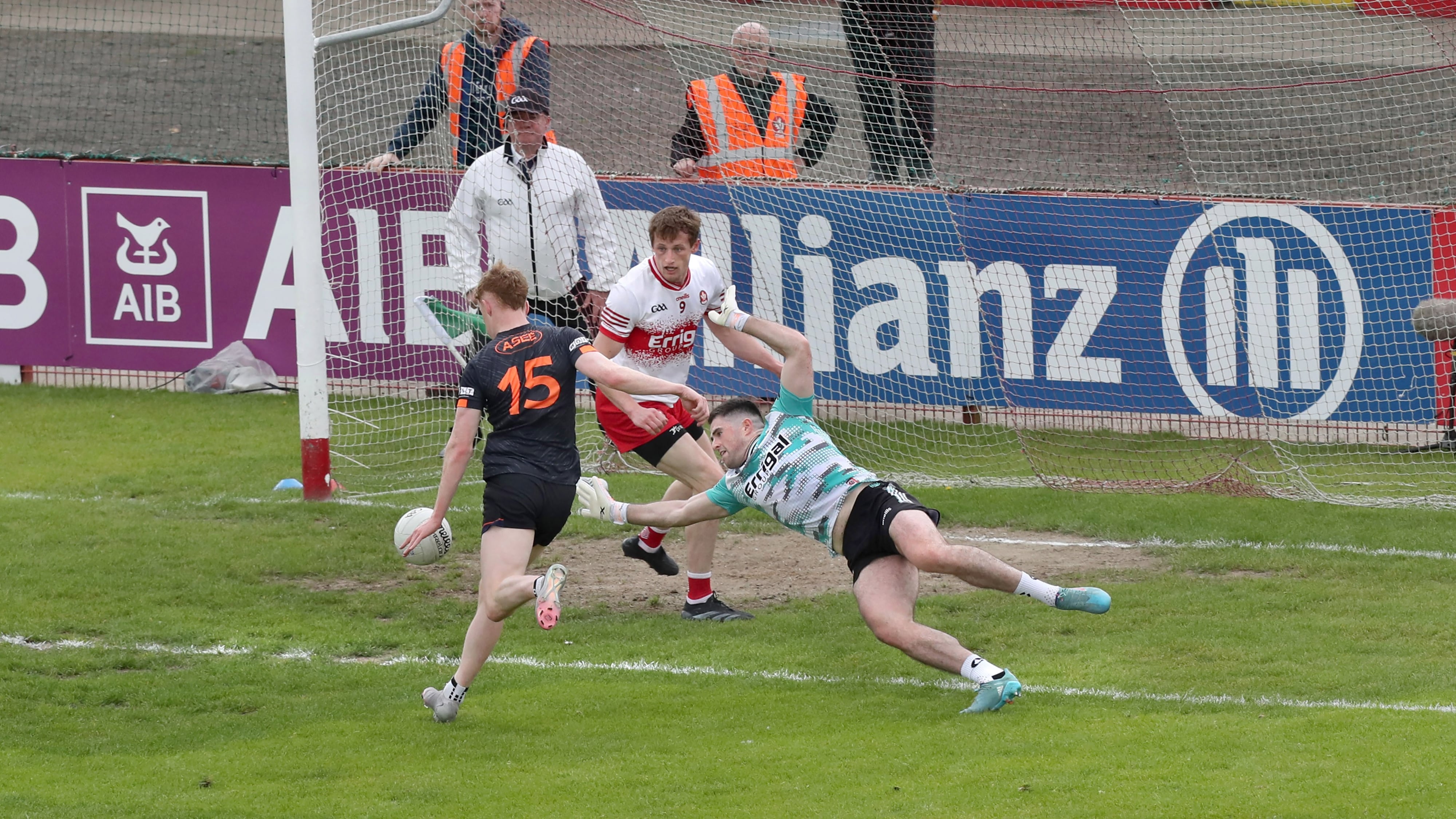 Conor Turbitt rolls home Armagh's second goal despite the best efforts of Odhran Lynch and Brendan Rogers. Picture: Margaret McLaughlin
