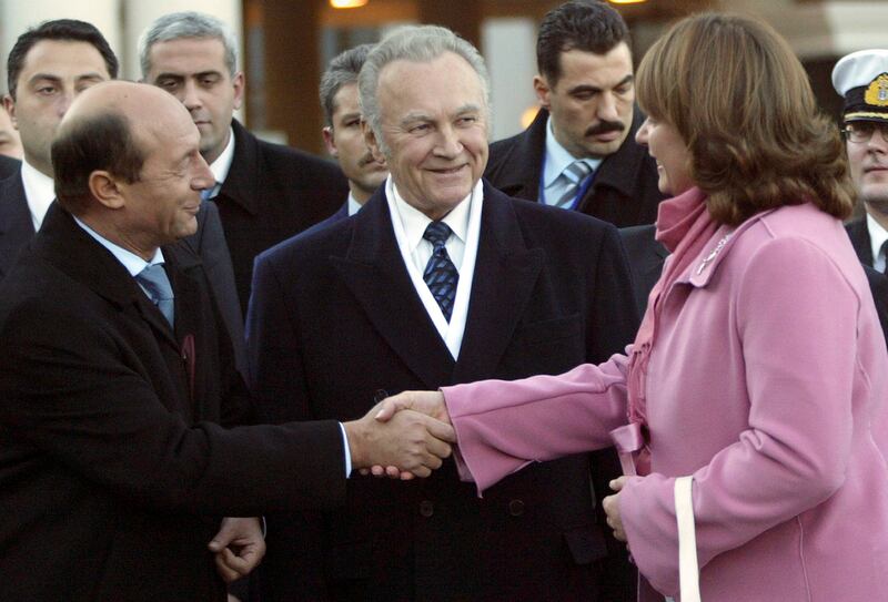 Georgian President Mikhail Saakashvili’s wife, Sandra Roelofs, welcomes Romanian President Traian Basescu, left, and Estonian President Arnold Ruutel, centre, to Tbilisi in November 2005 (Shakh Aivazov/AP)