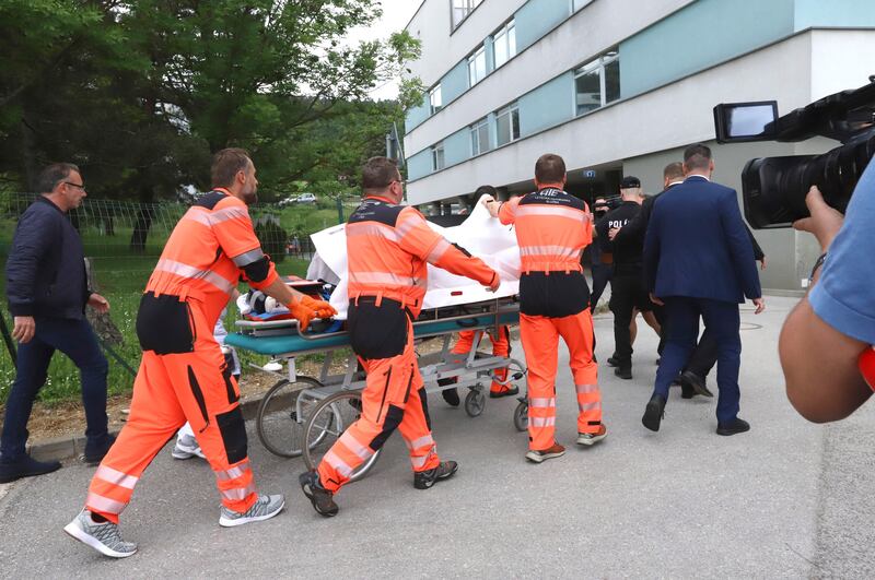 Medical workers take Robert Fico to a hospital in the town of Banska Bystrica (Jan Kroslak/TASR via AP)