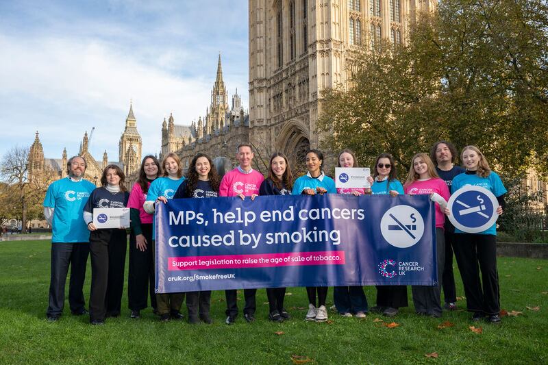 Representatives of Cancer Research UK outside the Houses of Parliaments as they urge MPs to back the Tobacco and Vapes Bill