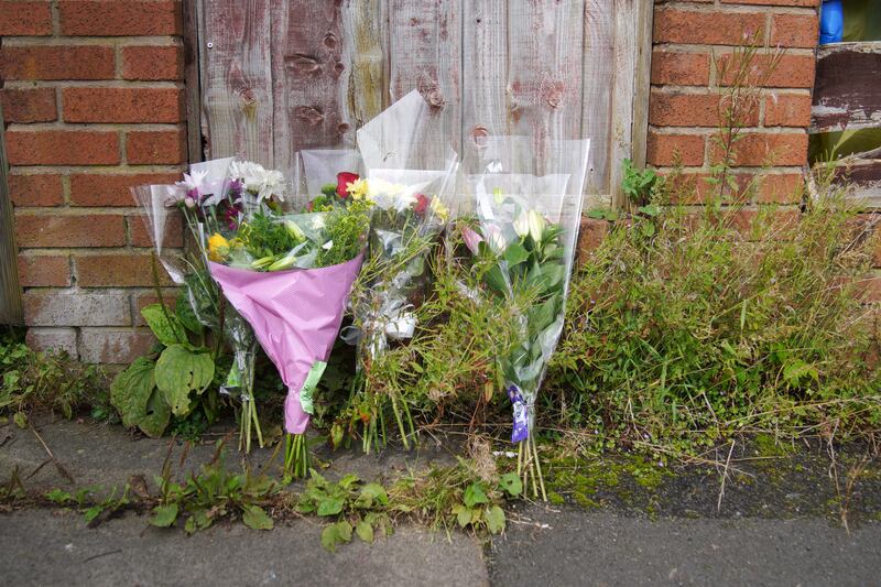 Flowers left outside Donald Patience’s property on Ainsworth Road