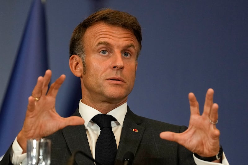 French President Emmanuel Macron gestures during a press conference in Belgrade, Serbia (Darko Vojinovic/AP)