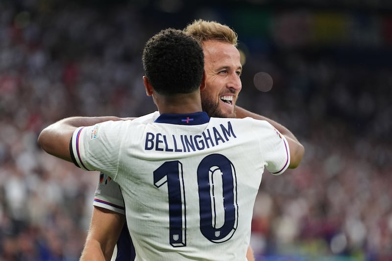 England’s Harry Kane celebrates with Jude Bellingham after scoring the winning goal against Slovakia.