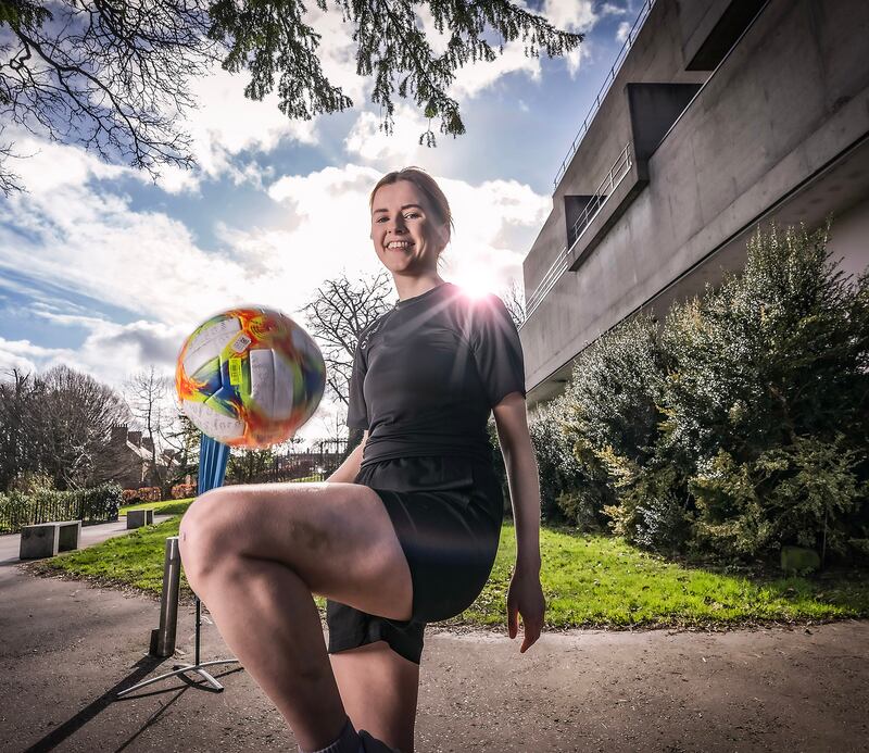 Girl playing football