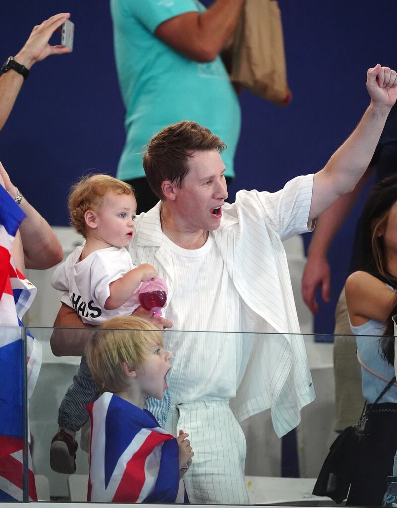 Dustin Lance Black pumped his fist as he watched his husband compete