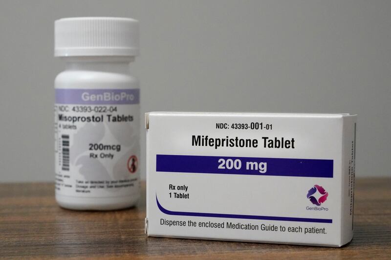 Containers of the medication used to end an early pregnancy sit on a table inside a Planned Parenthood clinic (Jeff Roberson/AP)