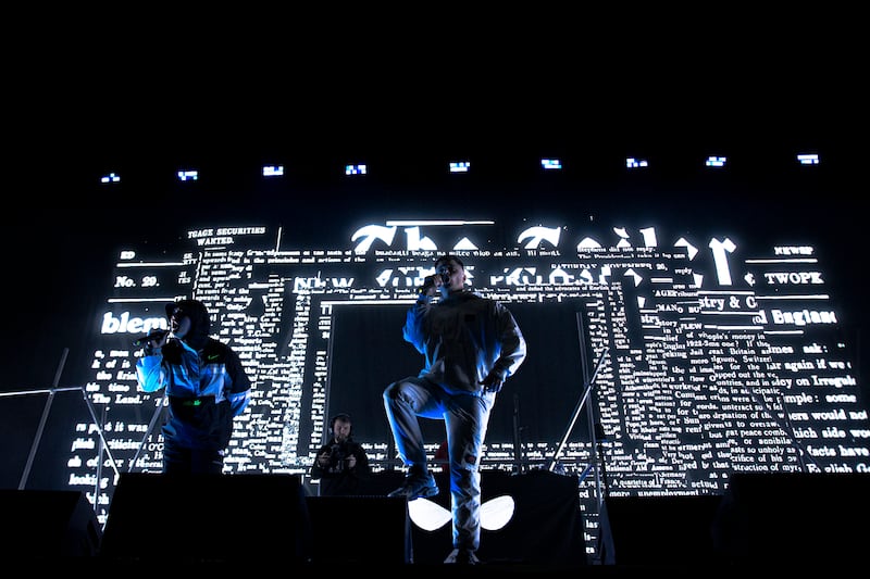 Kneecap performing on stage during their concert at Belfast's SSE Arena on Saturday night.