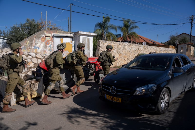 Israeli soldiers patrol the perimeter of the agricultural settlement of Avivim, next to the Lebanese border, in upper Galilee (Ohad Zwigenberg/AP)