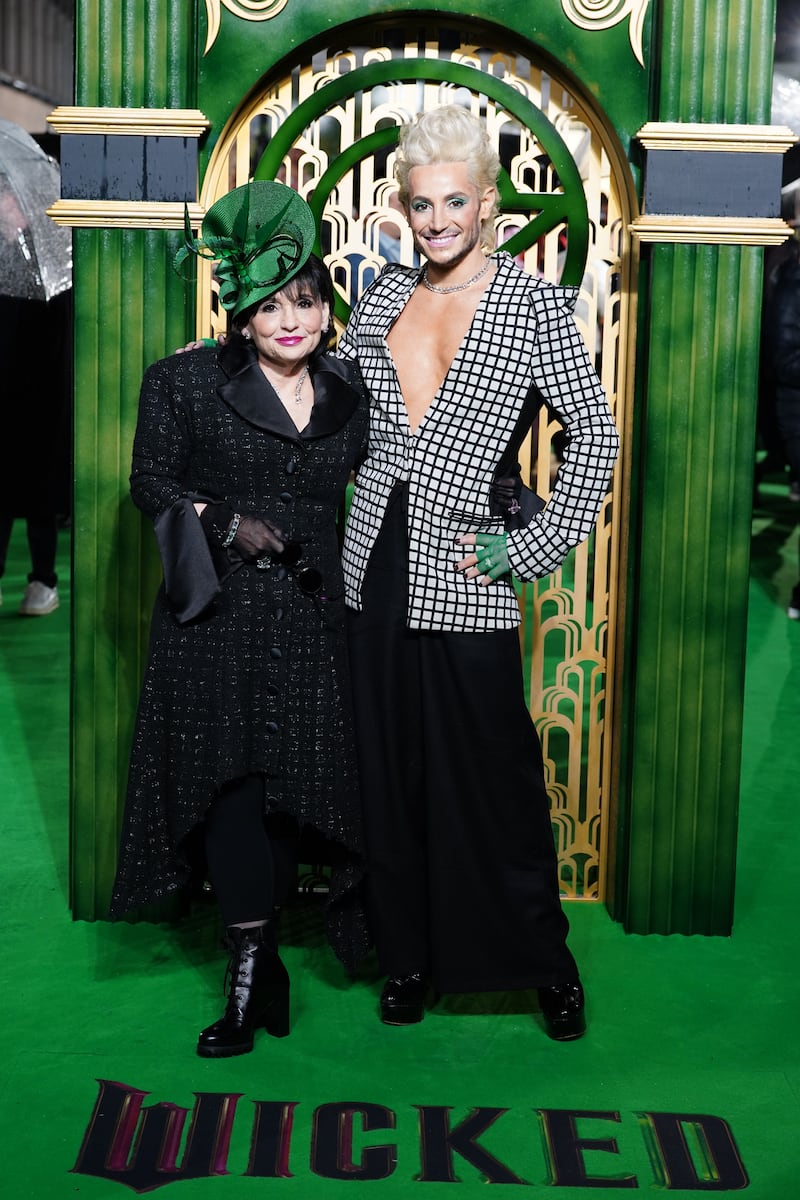 Joan Grande and Frankie Grande matched in black, white and green ensembles