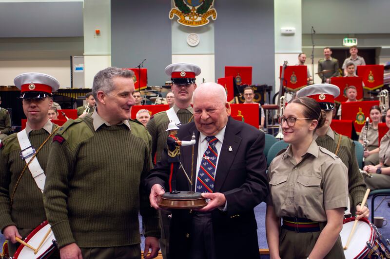 George Latham presents his drum major statue