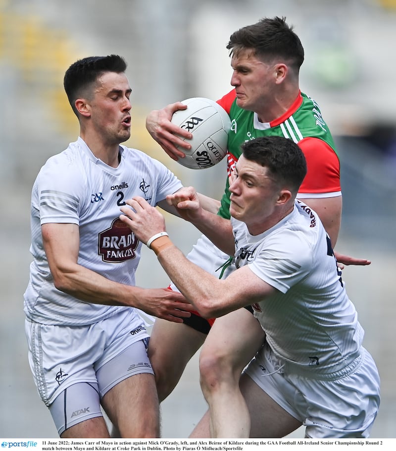 James Carr in action against Mick O'Grady, left, and Alex Beirne of Kildare during the GAA Football All-Ireland Senior Championship Round 2 match between Mayo and Kildare at Croke Park in Dublin. Photo by Piaras Ó Mídheach/Sportsfile