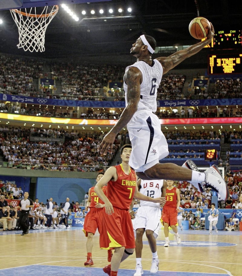 LeBron James (6) goes in for a dunk against China playing for Team USA at the Beijing 2008 Olympics. 