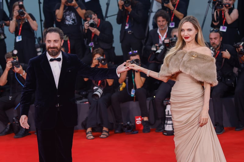 Director Pablo Larrain, left, and Angelina Jolie arriving for the premiere of the film Maria during the 81st edition of the Venice Film Festival (Vianney Le Caer/Invision/AP)