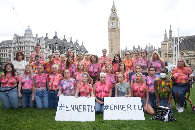 Loose Women presenter Nadia Sawalha joins campaigners in Westminster, central London, who have painted their breasts with messages calling for the breast cancer drug Enhertu to be made available on the NHS in England and Wales