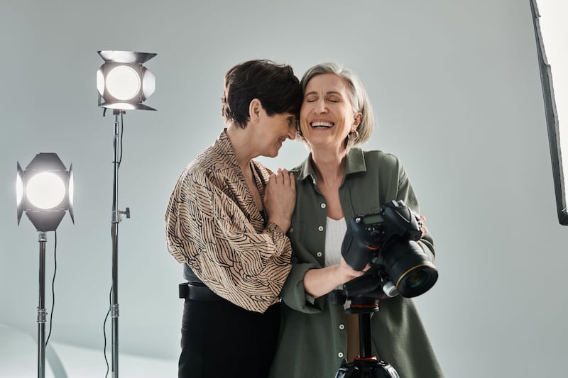 Two middle age ladies laughing together