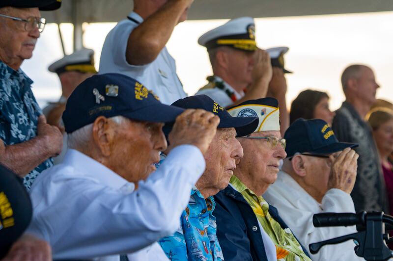 Pearl Harbour survivors (L to R) Harry Chandler, Ken Stevens, Herb Elfring and Ira ‘Ike’ Schab salute while the national anthem is played at the 2023 Remembrance Day (Mengshin Lin/AP)