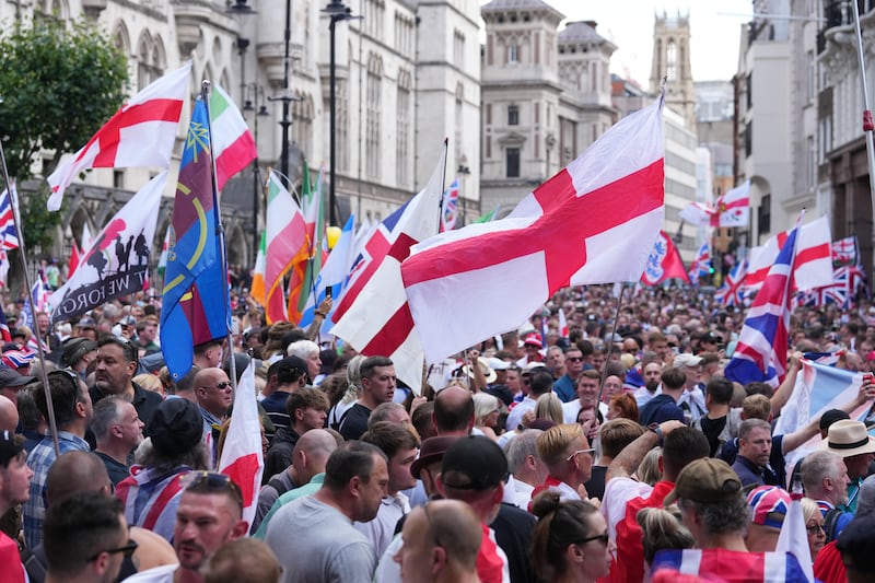 People take part in a protest march in central London organised by Tommy Robinson