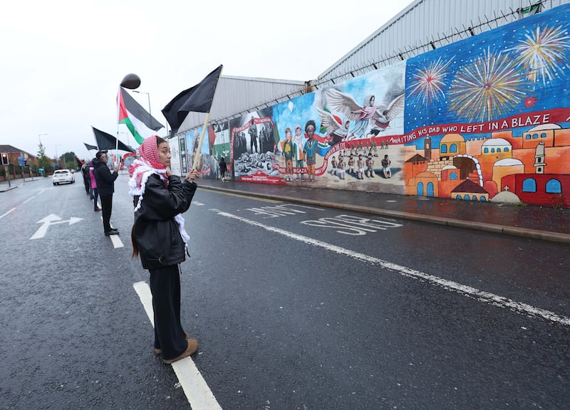 Supporters of the Palestinian people hold a black flag protest at the Murals on the Falls Road in West Belfast.
PICTURE COLM LENAGHAN