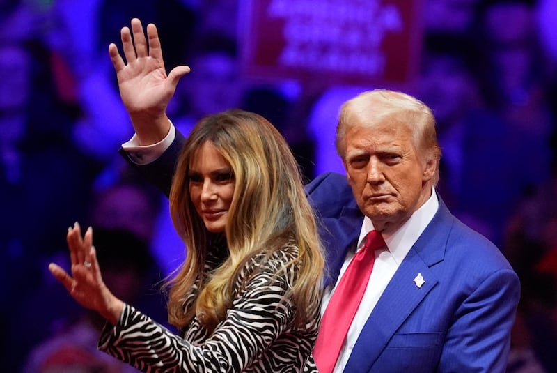 Donald Trump and his wife Melania at a campaign rally in New York Evan Vucci/AP)