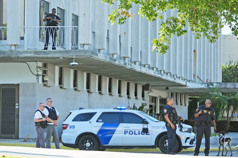 Law enforcement officers patrol outside the courthouse, where Ryan Wesley Routh appeared (Wilfredo Lee/AP)