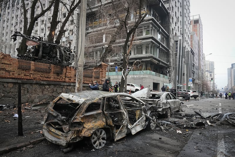 Police officers collect evidence following recent Russian attacks in Kyiv (Efrem Lukatsky/AP)