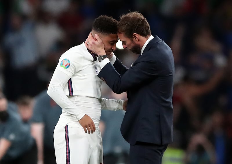 Gareth Southgate consoles Jadon Sancho following England’s penalty shoot-out defeat against Italy in the Euro 2020 final at Wembley .