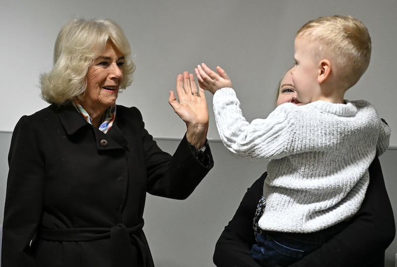 Queen Camilla meets blind patient Jackson James and his mother at Great Western Hospital in Swindon, Wiltshire