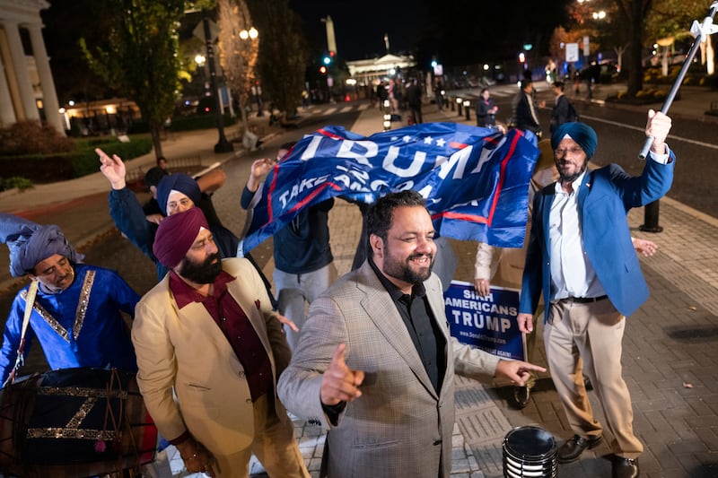 Supporters of Republican presidential nominee Donald Trump dancing outside the White House in Washington DC (AP Photo/Nathan Howard)