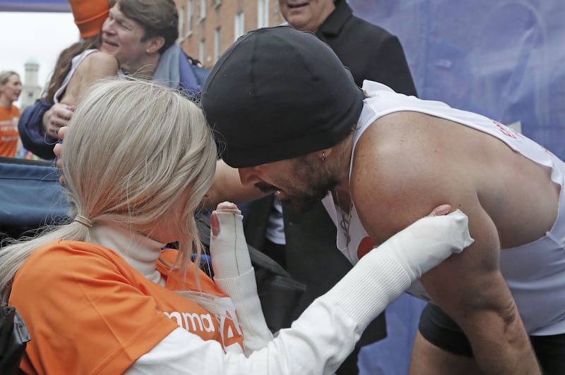 Farrell and Miss Fogarty hug on the finishing line