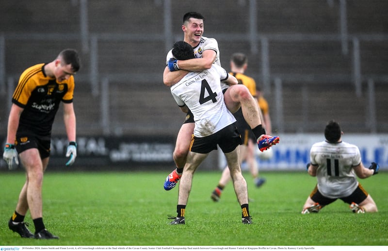 James Smith and Fionn Lovett (number 4) of Crosserlough celebrate at the final whistle of the Cavan County Senior Club Football Championship final match between Crosserlough and Ramor United at Kingspan Breffni in Cavan.