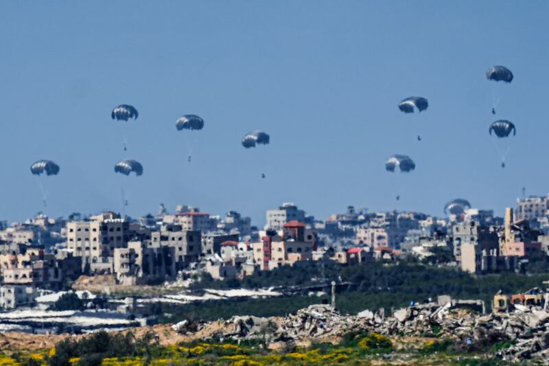 Parachutes drop supplies into the northern Gaza Strip (Ariel Schalit/AP)