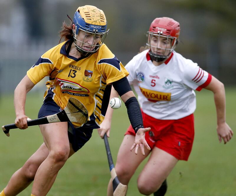 Paula O'Hagan on the attack for Clonduff during Sunday's semi-final as Loughgiel's Maria O'Hara looks to close her down.