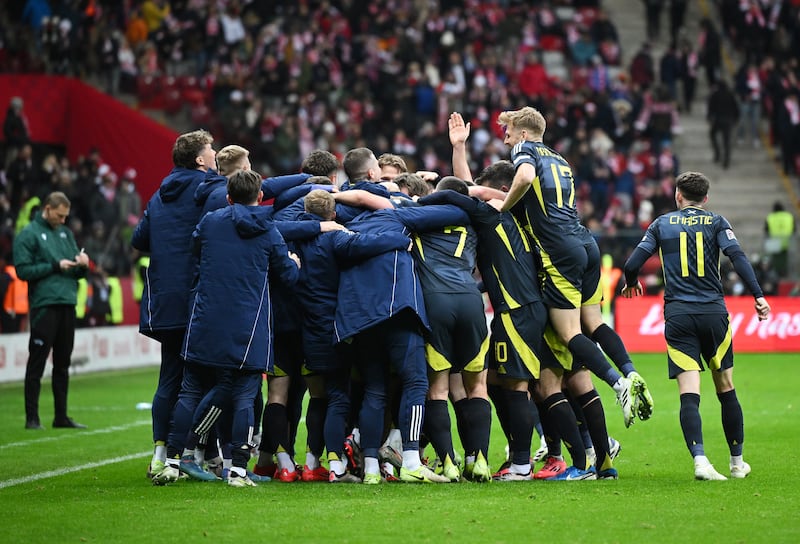 Scotland’s players celebrated with coaching staff after sealing a 2-1 win in Poland