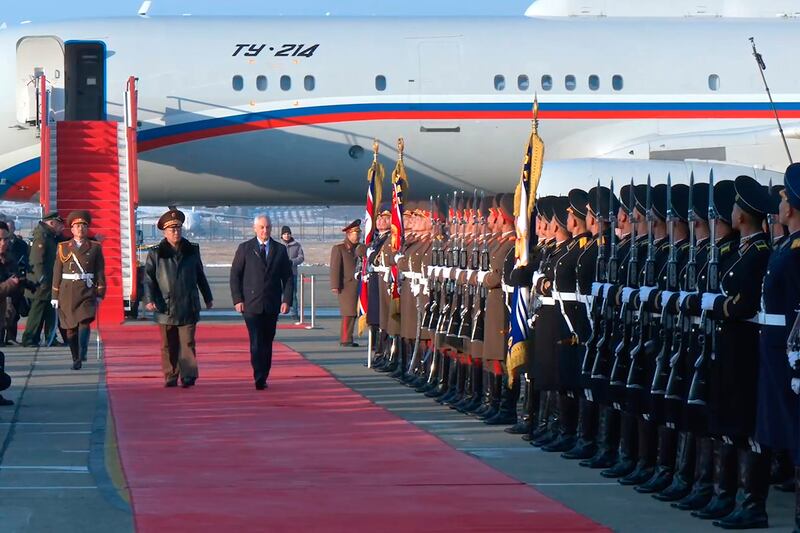 Mr Belousov, right on the red carpet, is welcomed by No Kwang Chol upon his arrival at Pyongyang International Airport (Russian Defence Press Service via AP)