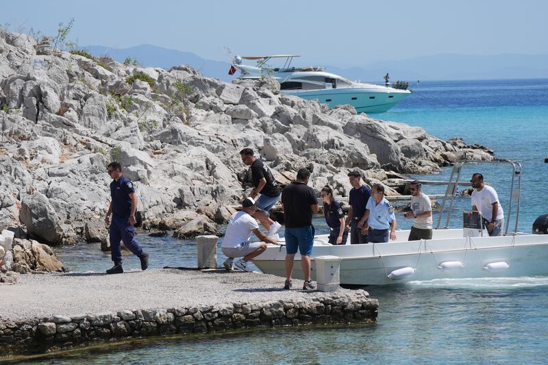 Emergency services on a boat at Agia Marina in Symi, Greece, where a body has been discovered during a search and rescue operation for TV doctor and columnist Michael Mosley