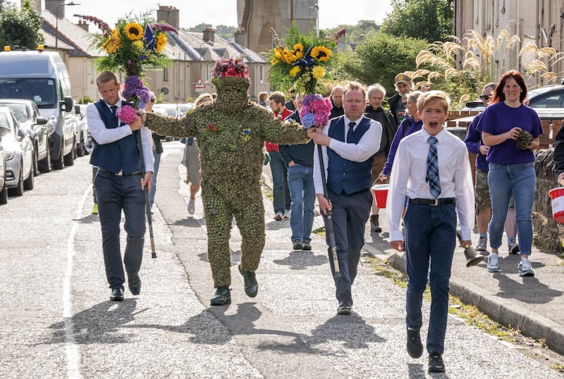 The Burryman – real name Andrew Taylor – parades through South Queensferry